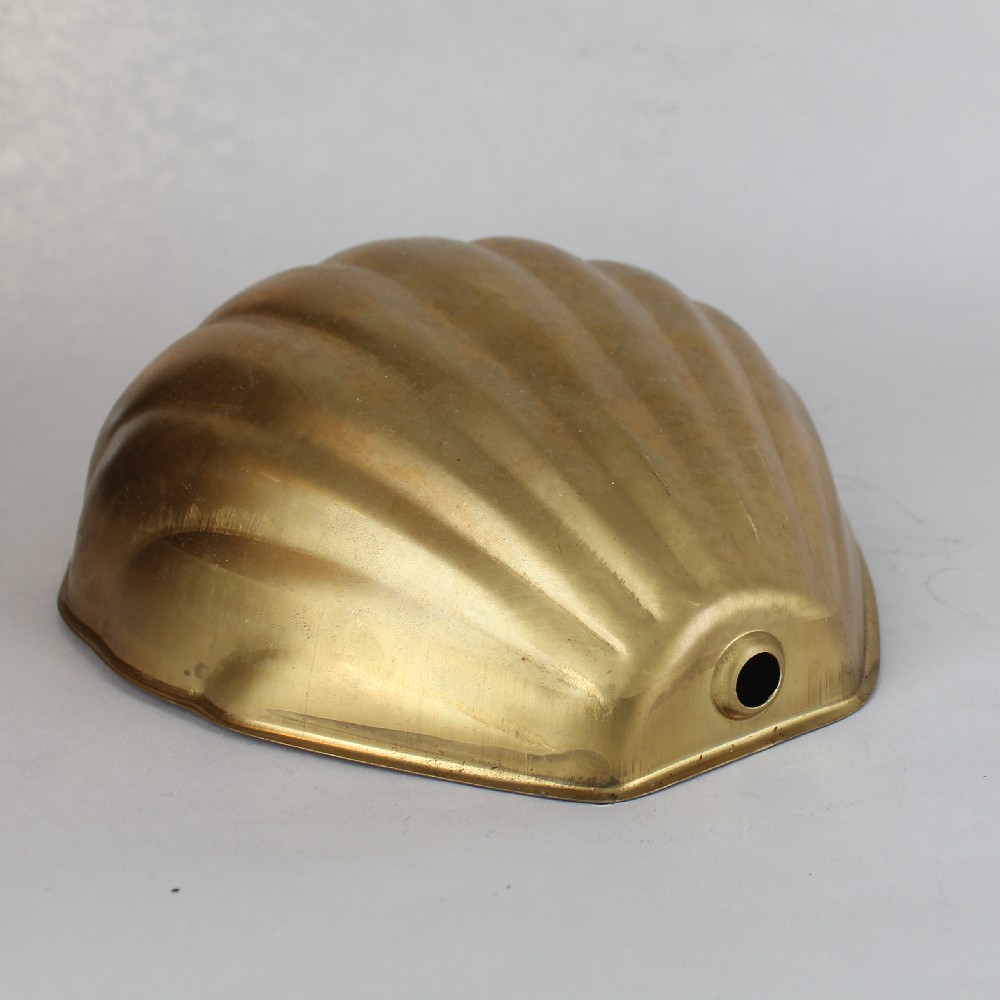 Shell Shade with 1/8ips. Slip Through Hole - Unfinished Brass Questions & Answers